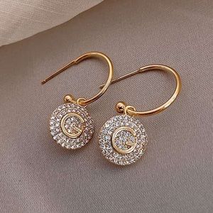 Gold Diamond “G” Drop Earrings